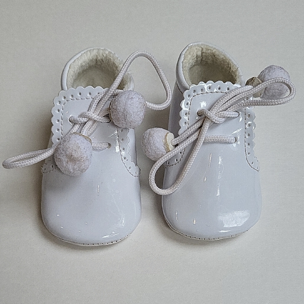White Baby Shoes with Pom Poms
